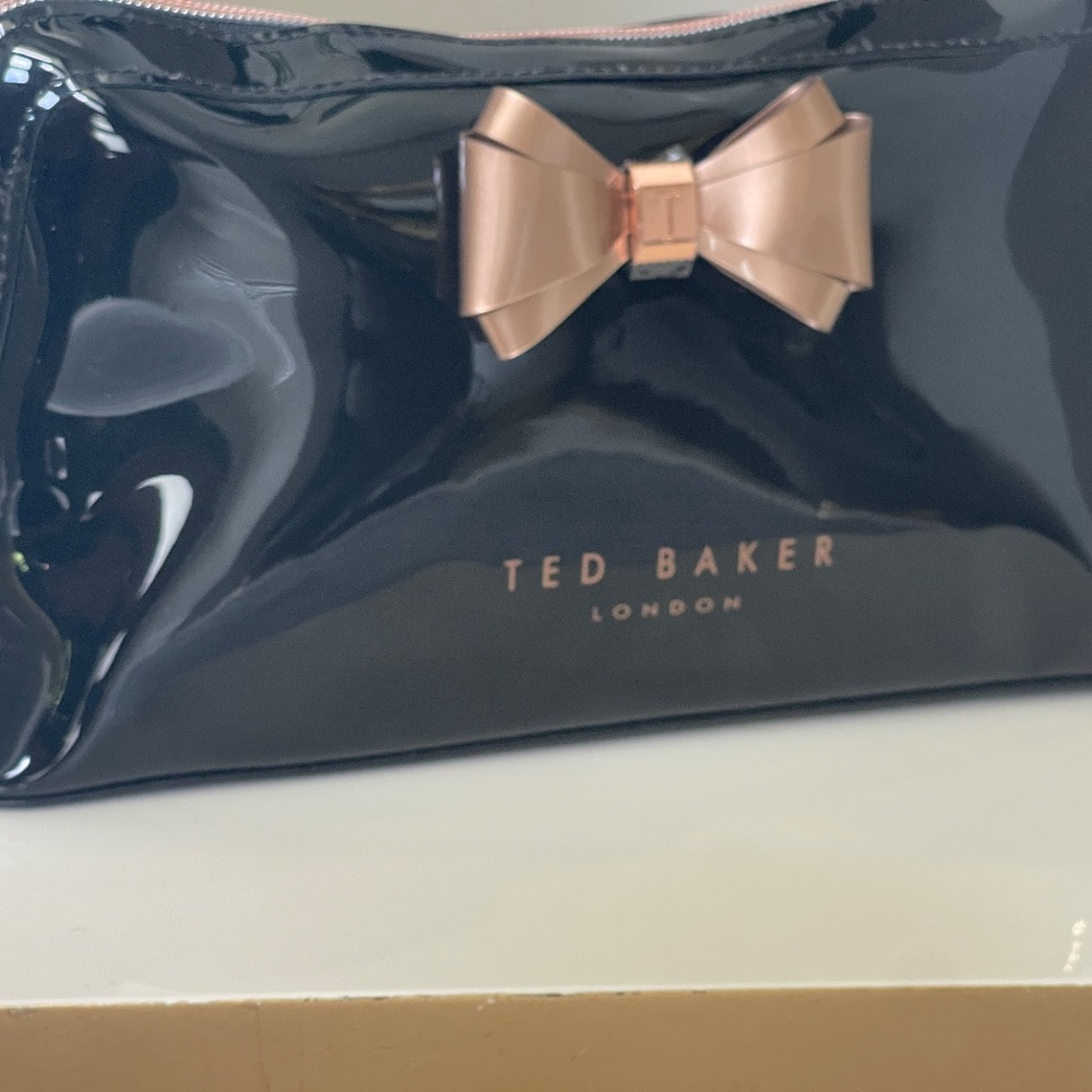 Ted Baker Patent Black Leather Clutch with Gold Bow and top zip closure